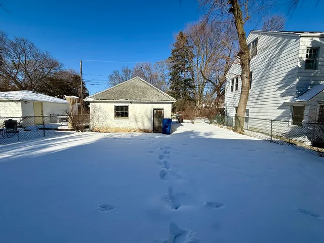 a front view of a house with a garage