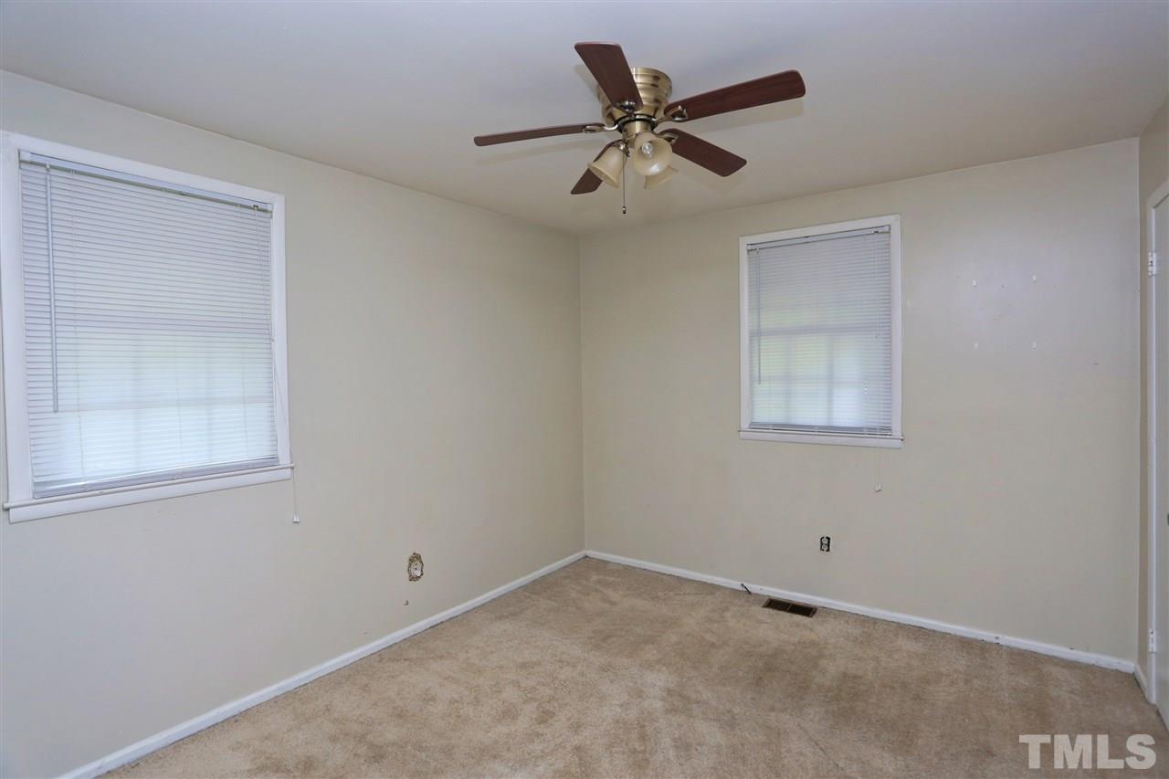 706 Fitzgerald Drive Raleigh, NC 27610 - Photo 8 of 10 an empty room with a window