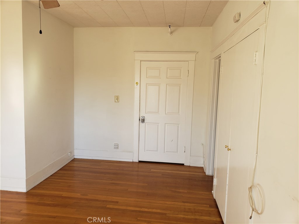 323 West 4th Street, Unit 304 Long Beach, CA 90802 - Photo 11 of 30 a view of an empty room with wooden floor