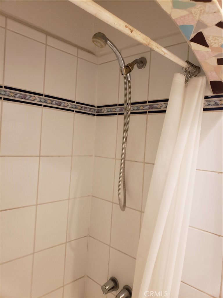 323 West 4th Street, Unit 304 Long Beach, CA 90802 - Photo 23 of 30 a bathroom with a shower