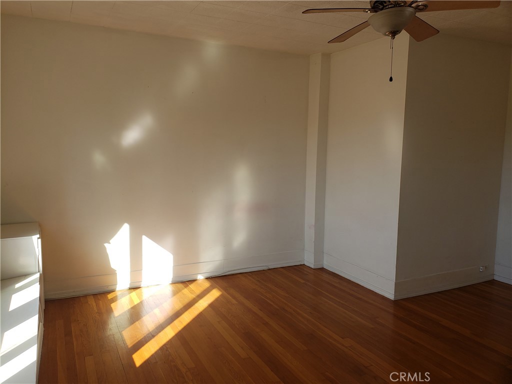 323 West 4th Street, Unit 304 Long Beach, CA 90802 - Photo 6 of 30 a view of empty room with wooden floor