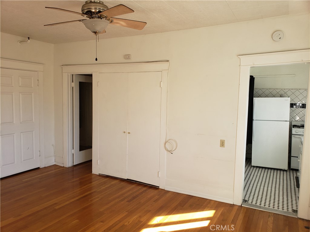 323 West 4th Street, Unit 304 Long Beach, CA 90802 - Photo 7 of 30 a view of a hallway with wooden floor