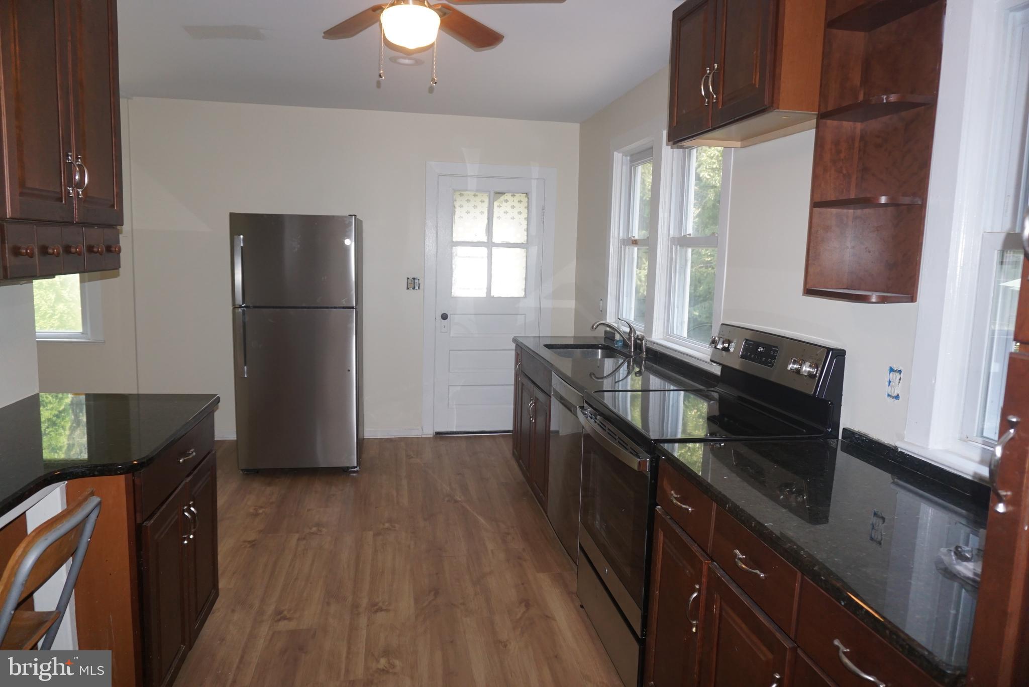 18 Oakland Street Princeton, NJ 08540 - Photo 4 of 9 a kitchen with granite countertop a refrigerator stove and sink