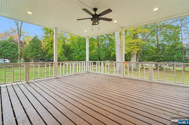 a view of a balcony with wooden floor