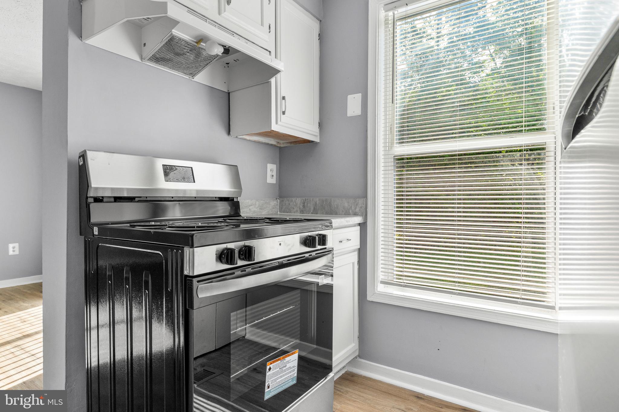 9479 Inaugural Drive King George, VA 22485 - Photo 9 of 26 a kitchen with a stove and a window