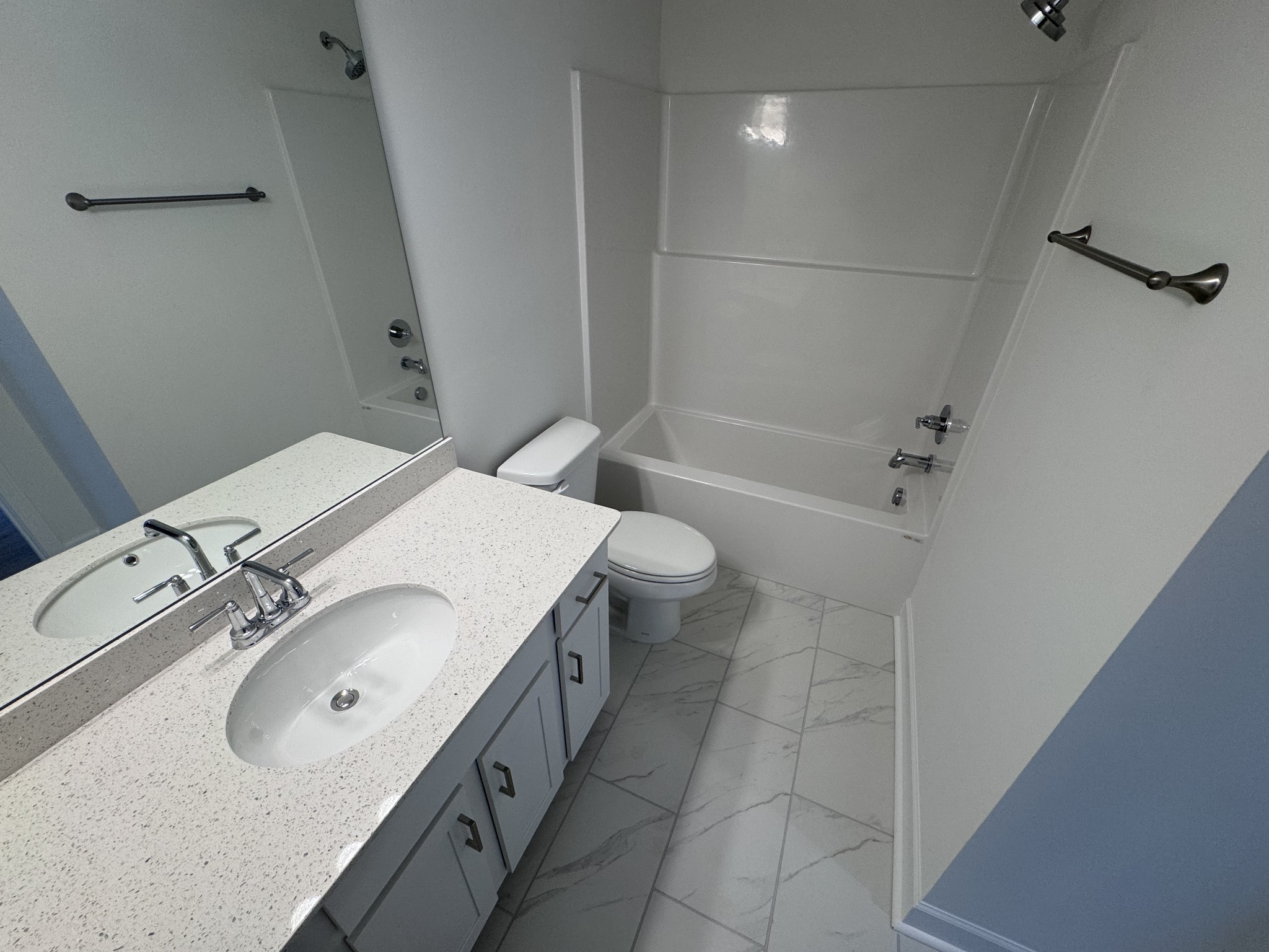 1095 June Wilde Ridge Spring Hill, TN 37174 - Photo 18 of 33 a bathroom with a granite countertop sink a toilet and shower