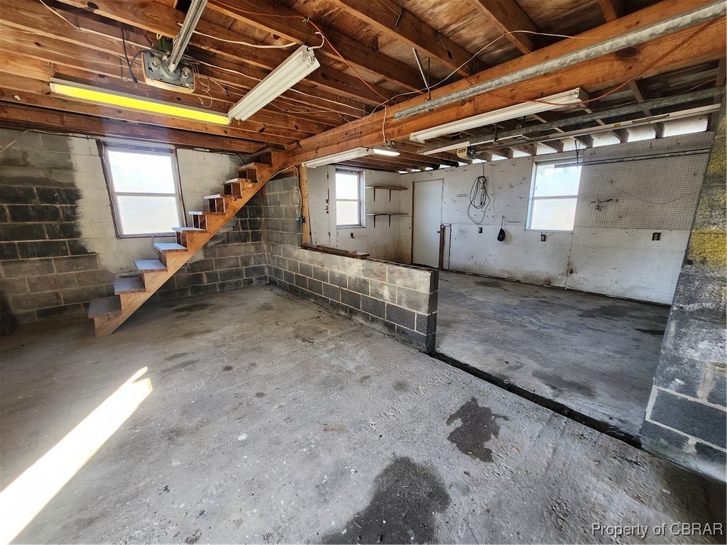 10013 Bonniville Road Hayes, VA 23072 - Photo 23 of 27 Left side garage bay with stairs to???????????????????????????????? storage