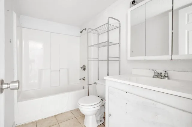 a bathroom with a sink a toilet and a bathtub