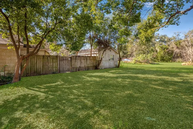 a view of a house with a big yard