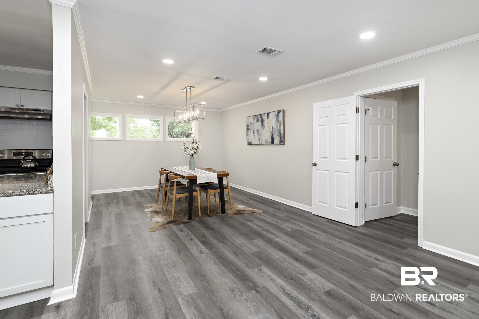 5922 Sunnyside Drive Mobile, AL 36619 - Photo 7 of 51 Dining area featuring crown molding, dark wood-type flooring, baseboards, recessed lighting, and a chandelier