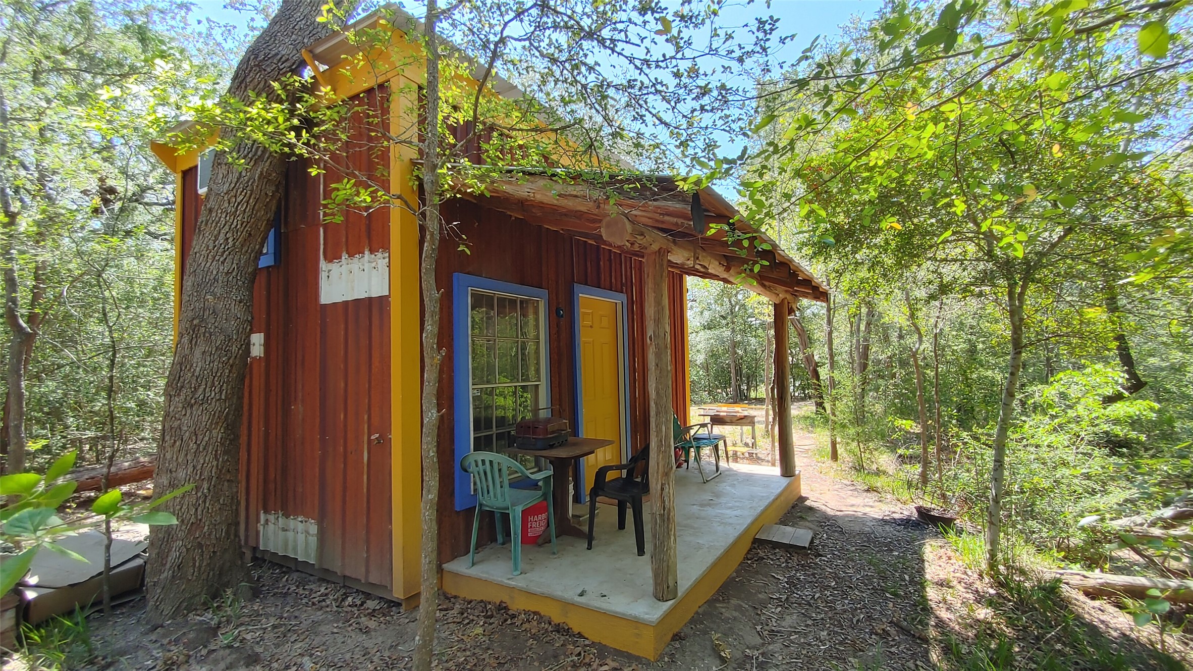 278 Country Way Road Smithville, TX 78957 - Photo 5 of 24 a view of a porch with chairs and potted plants