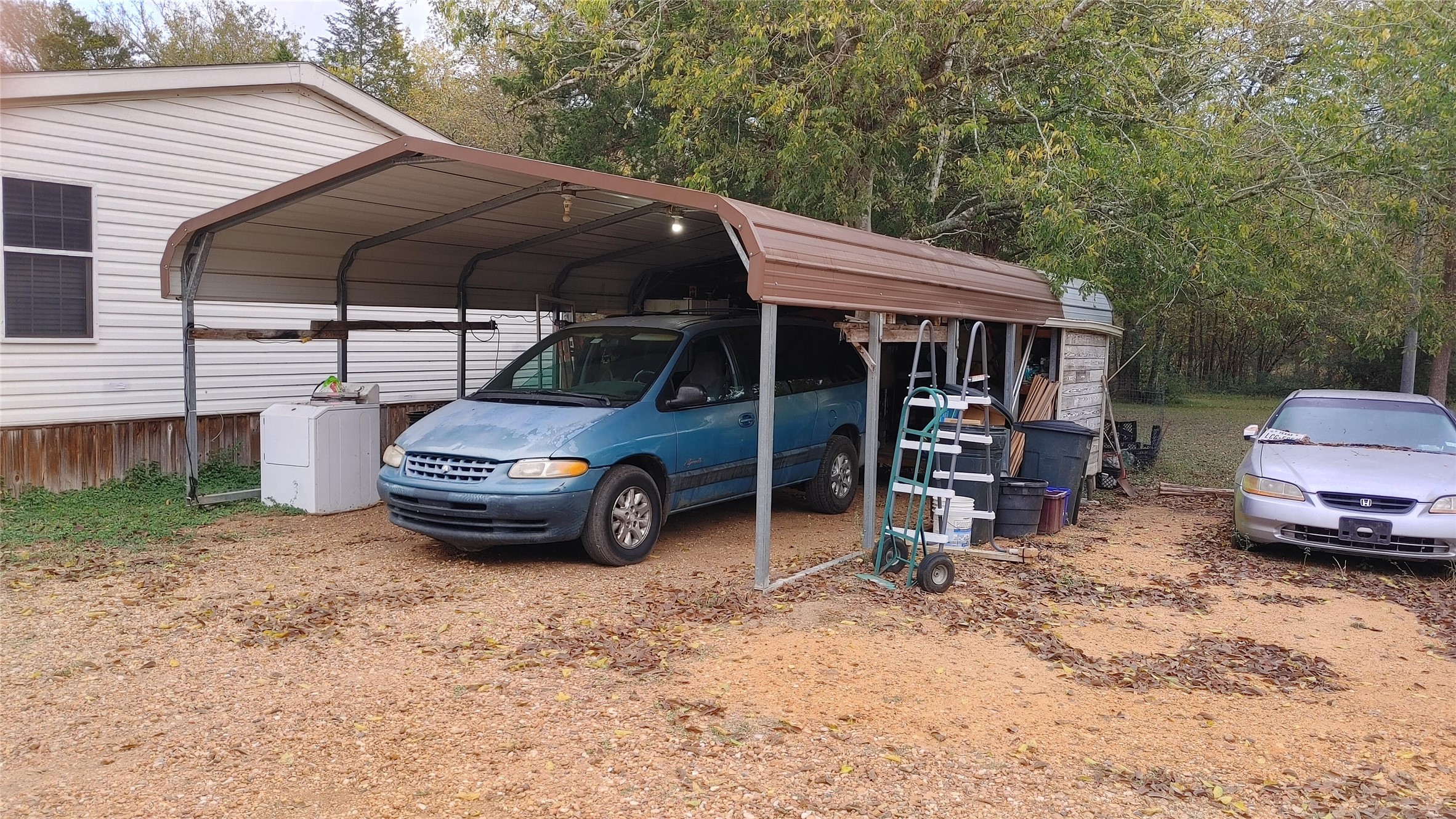 278 Country Way Road Smithville, TX 78957 - Photo 9 of 24 a car parked in front of a house