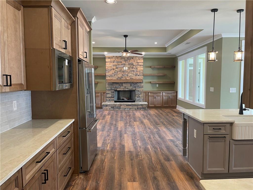 500 Mill Farm Lane Monroe, GA 30655 - Photo 11 of 35 a kitchen with stainless steel appliances granite countertop a stove and cabinets