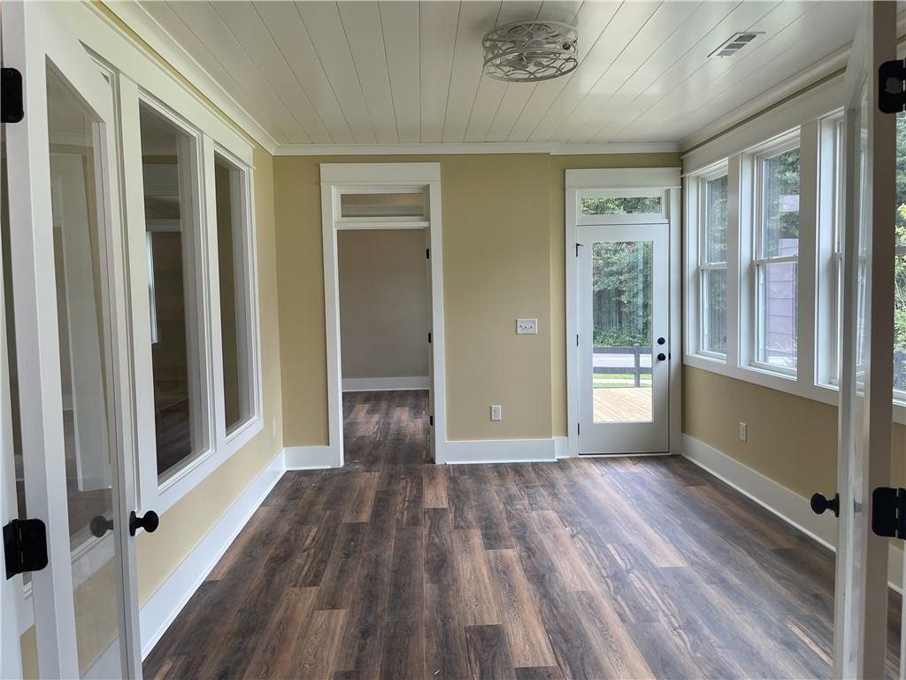 500 Mill Farm Lane Monroe, GA 30655 - Photo 16 of 35 a view of a hallway with wooden floor and staircase