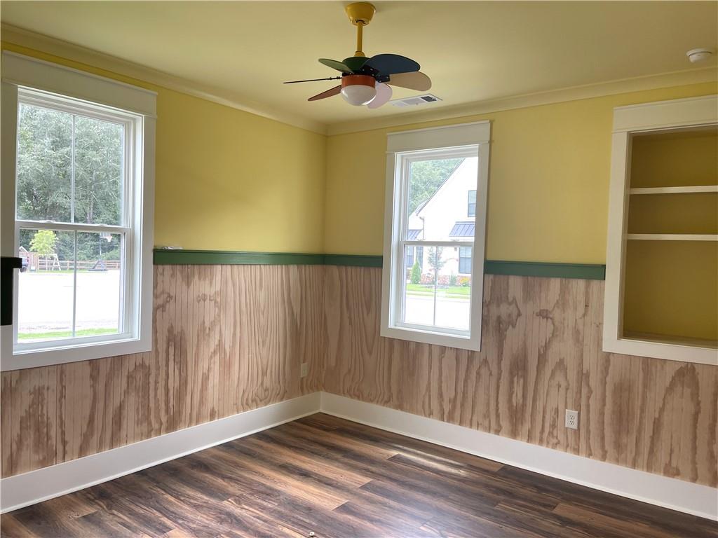 500 Mill Farm Lane Monroe, GA 30655 - Photo 18 of 35 a view of an empty room with a window and wooden floor