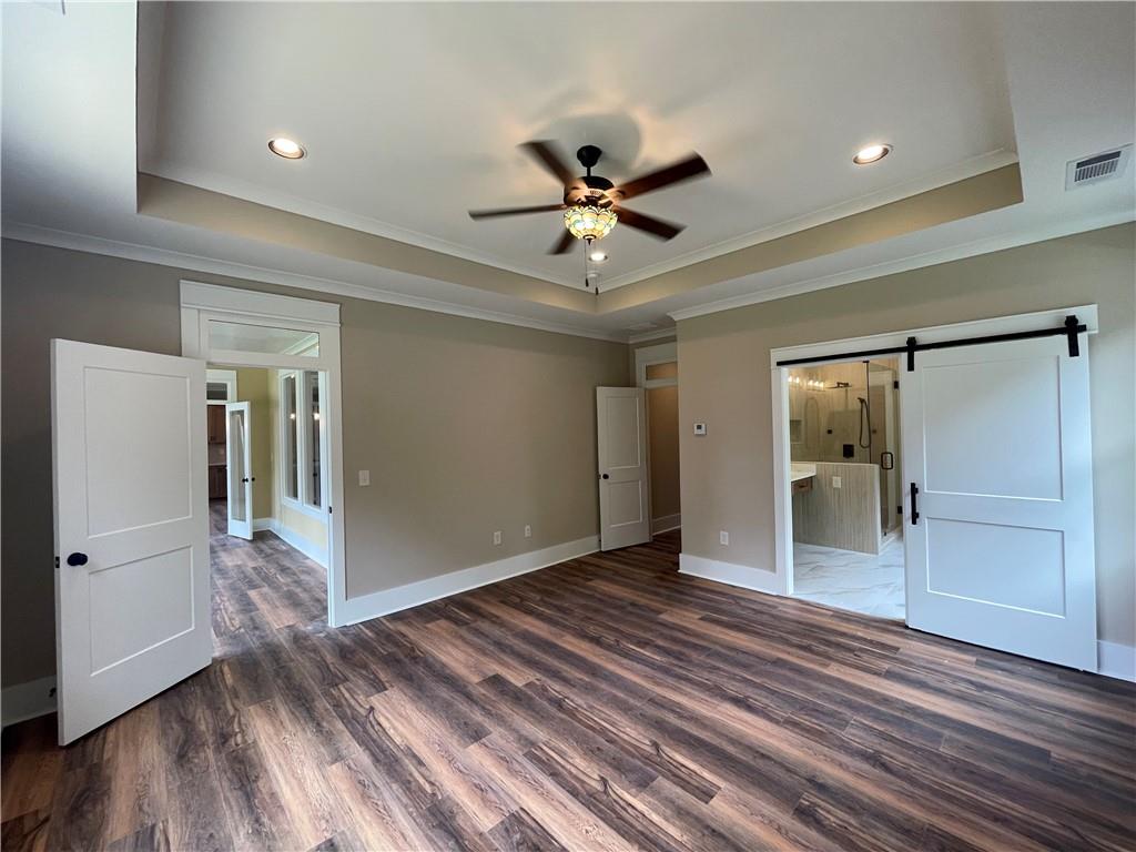 500 Mill Farm Lane Monroe, GA 30655 - Photo 21 of 35 a view of a room with wooden floor and a ceiling fan