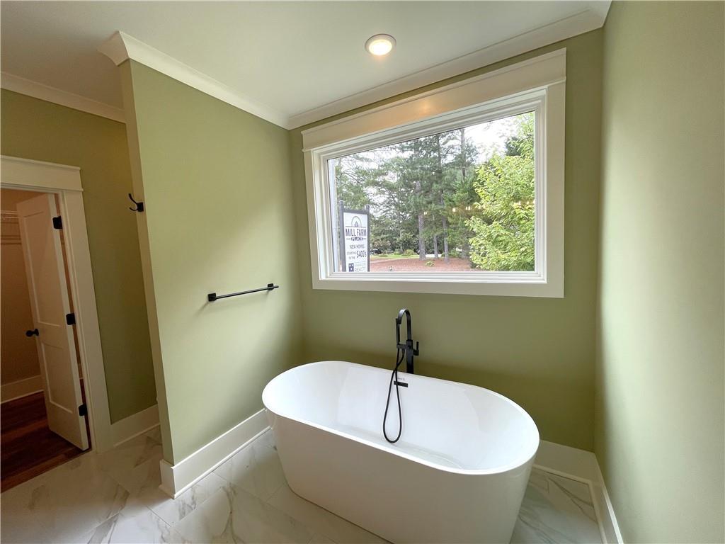 500 Mill Farm Lane Monroe, GA 30655 - Photo 24 of 35 a spacious bathroom with a bathtub and shower