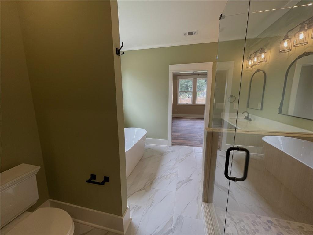 500 Mill Farm Lane Monroe, GA 30655 - Photo 25 of 35 a bathroom with a granite countertop sink toilet and shower