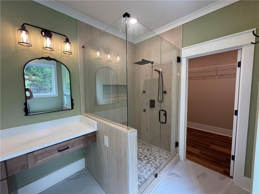 500 Mill Farm Lane Monroe, GA 30655 - Photo 28 of 35 a bathroom with a sink a mirror and a shower