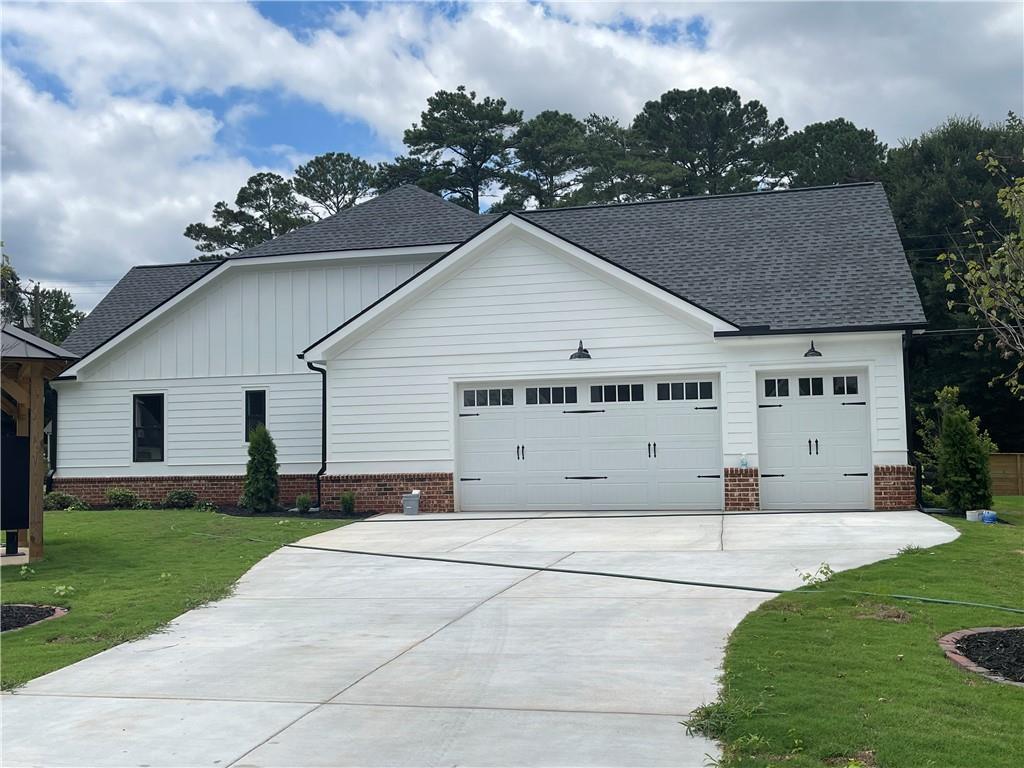 500 Mill Farm Lane Monroe, GA 30655 - Photo 3 of 35 a view of a house with a yard and potted plants