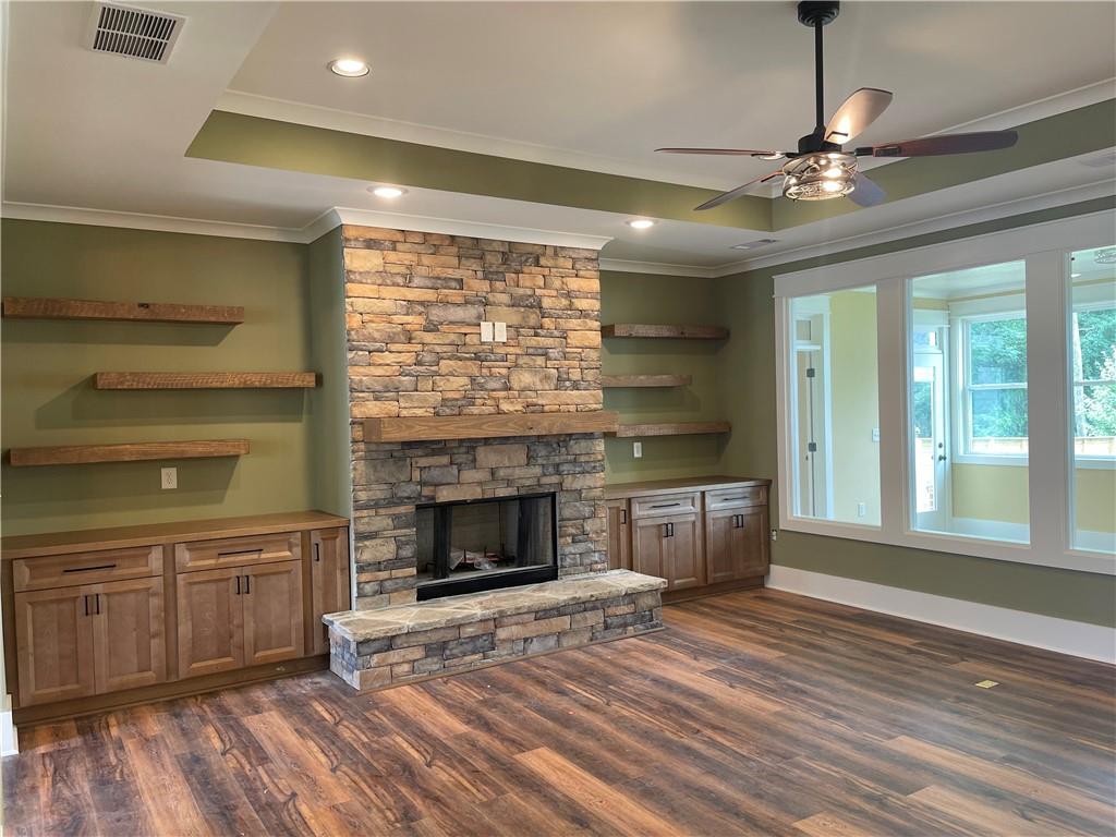 500 Mill Farm Lane Monroe, GA 30655 - Photo 10 of 35 a view of an empty room with a fireplace and a window