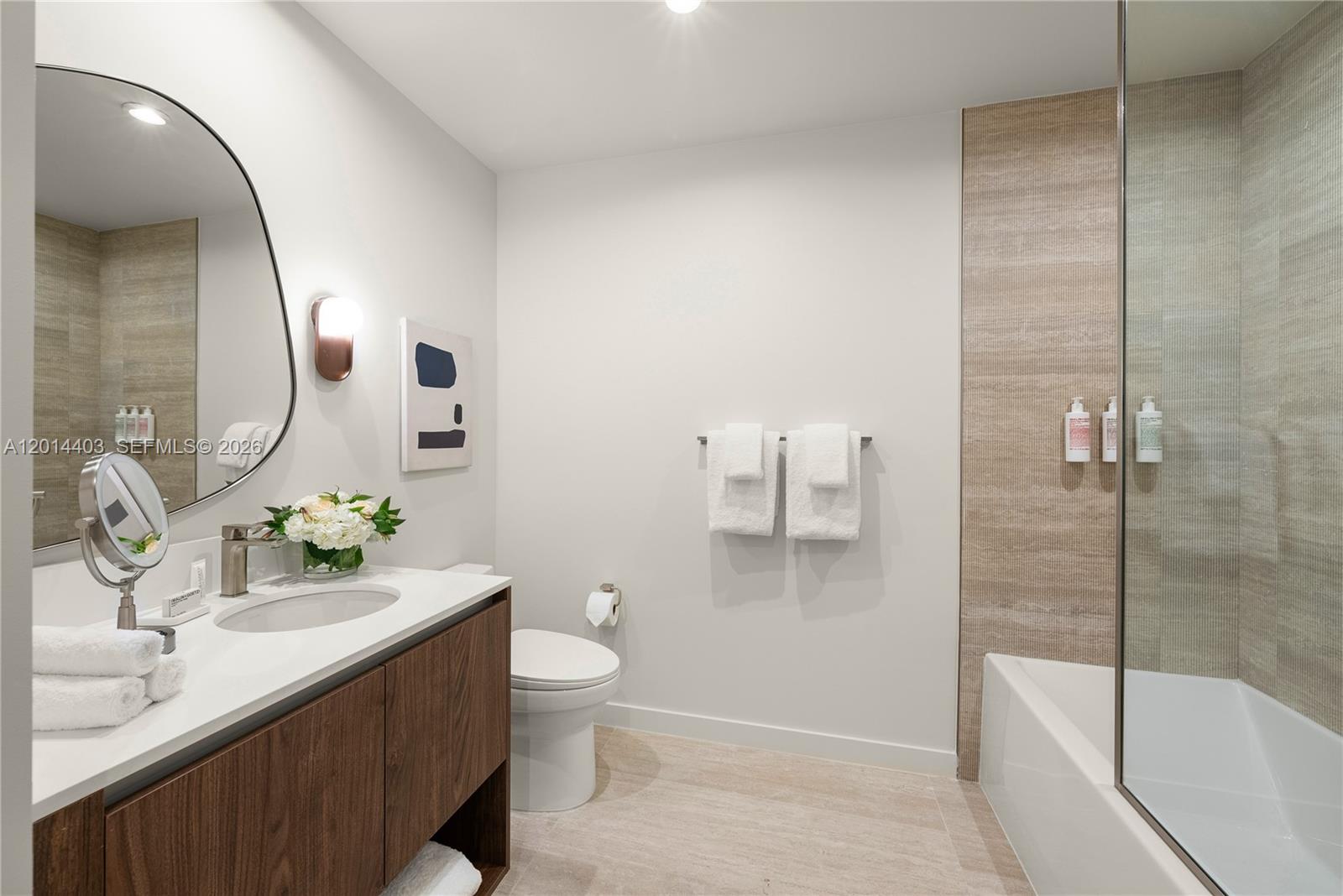 1611 Southwest 2nd Avenue, Unit 314 Miami, FL 33129 - Photo 4 of 16 a bathroom with a sink a toilet and shower