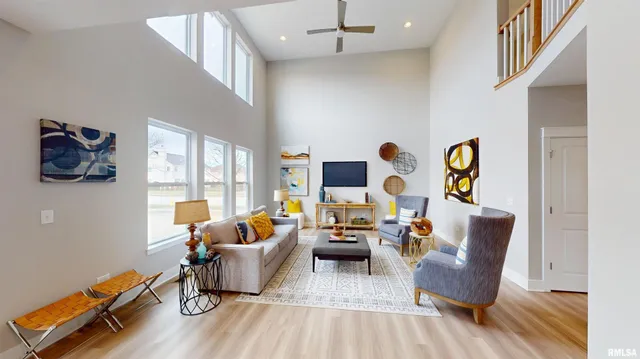 a living room with furniture rug and wooden floor