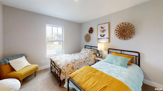 a bedroom with two beds and a couch