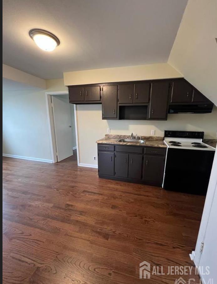 1061 King Georges Post Road Edison, NJ 08837 - Photo 6 of 10 a kitchen with stainless steel appliances granite countertop a sink and cabinets