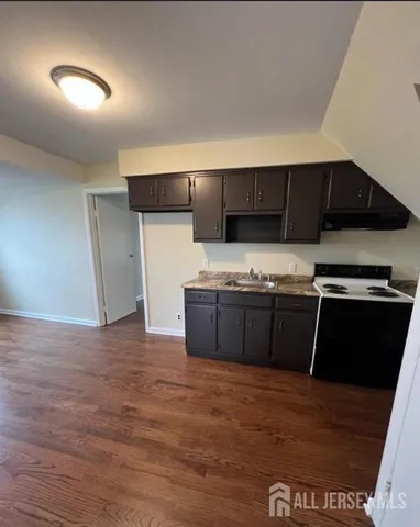 a kitchen with a stove and a refrigerator