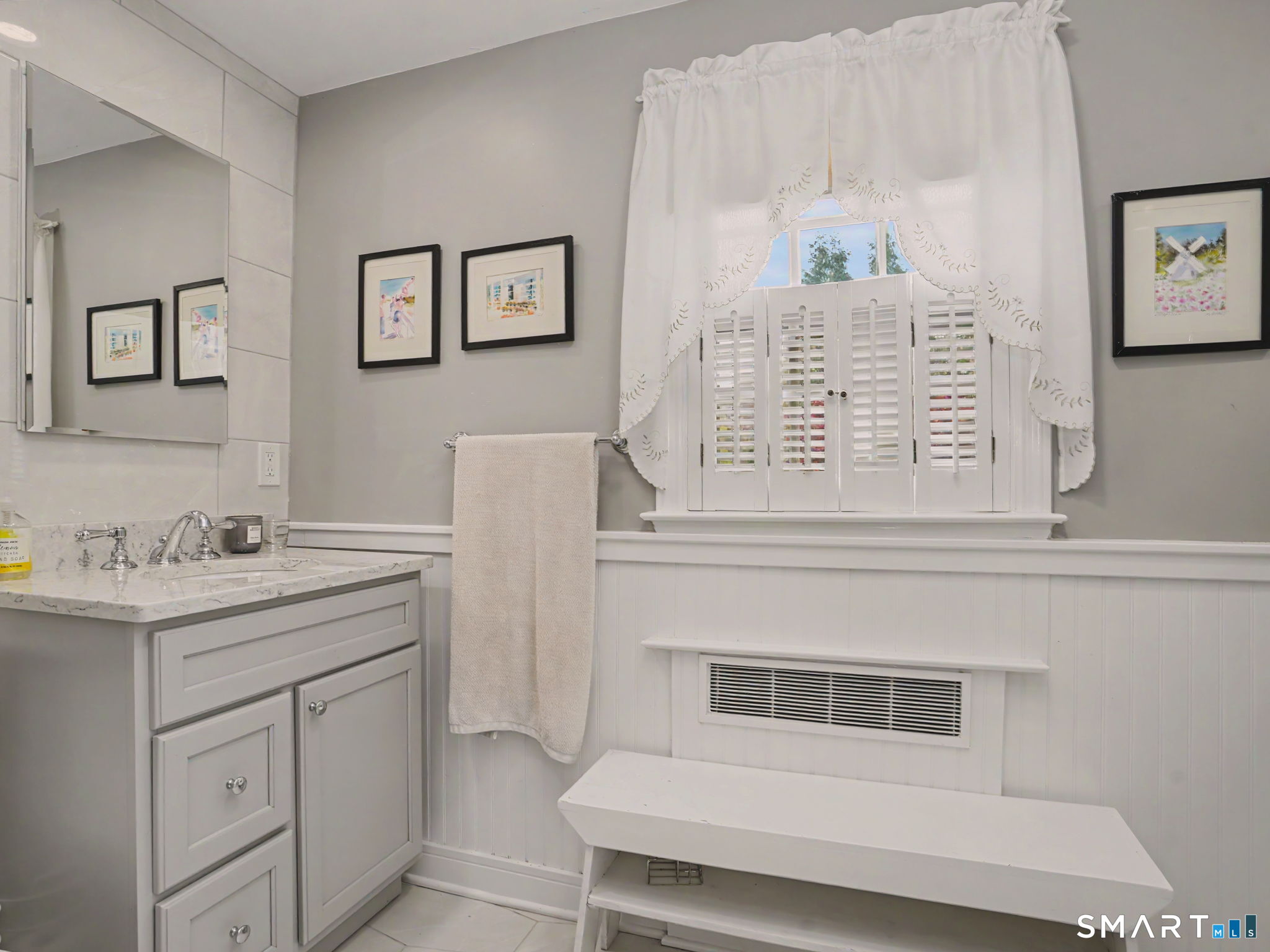 20 Chelsea Street Fairfield, CT 06824 - Photo 15 of 28 a bathroom with a sink and a mirror