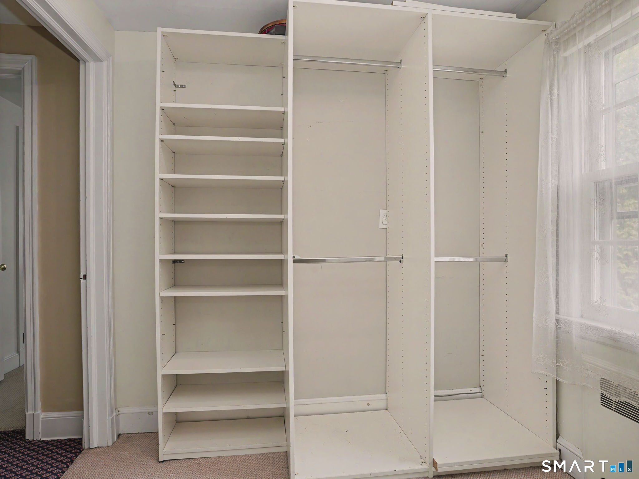 20 Chelsea Street Fairfield, CT 06824 - Photo 18 of 28 a view of walk in closet with empty racks