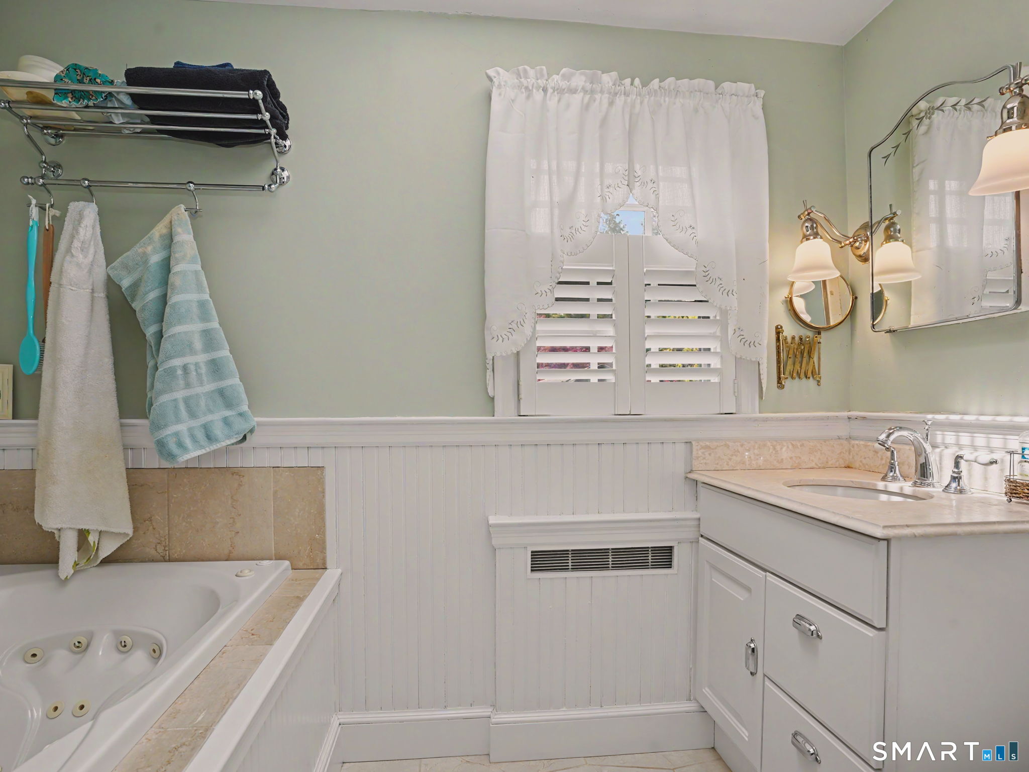 20 Chelsea Street Fairfield, CT 06824 - Photo 19 of 28 a bathroom with a bathtub sink and mirror