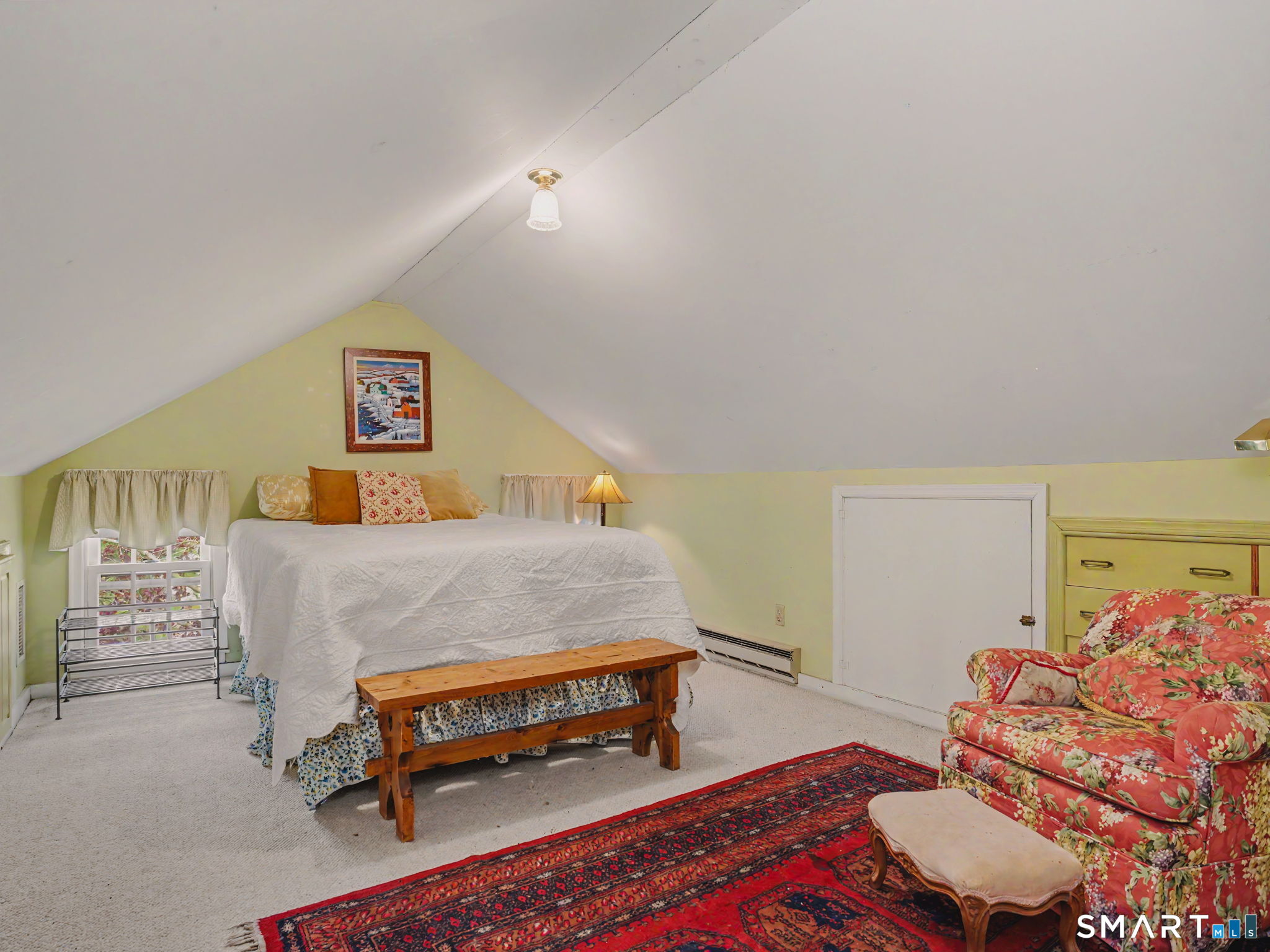 20 Chelsea Street Fairfield, CT 06824 - Photo 20 of 28 a bedroom with a bed and a couch