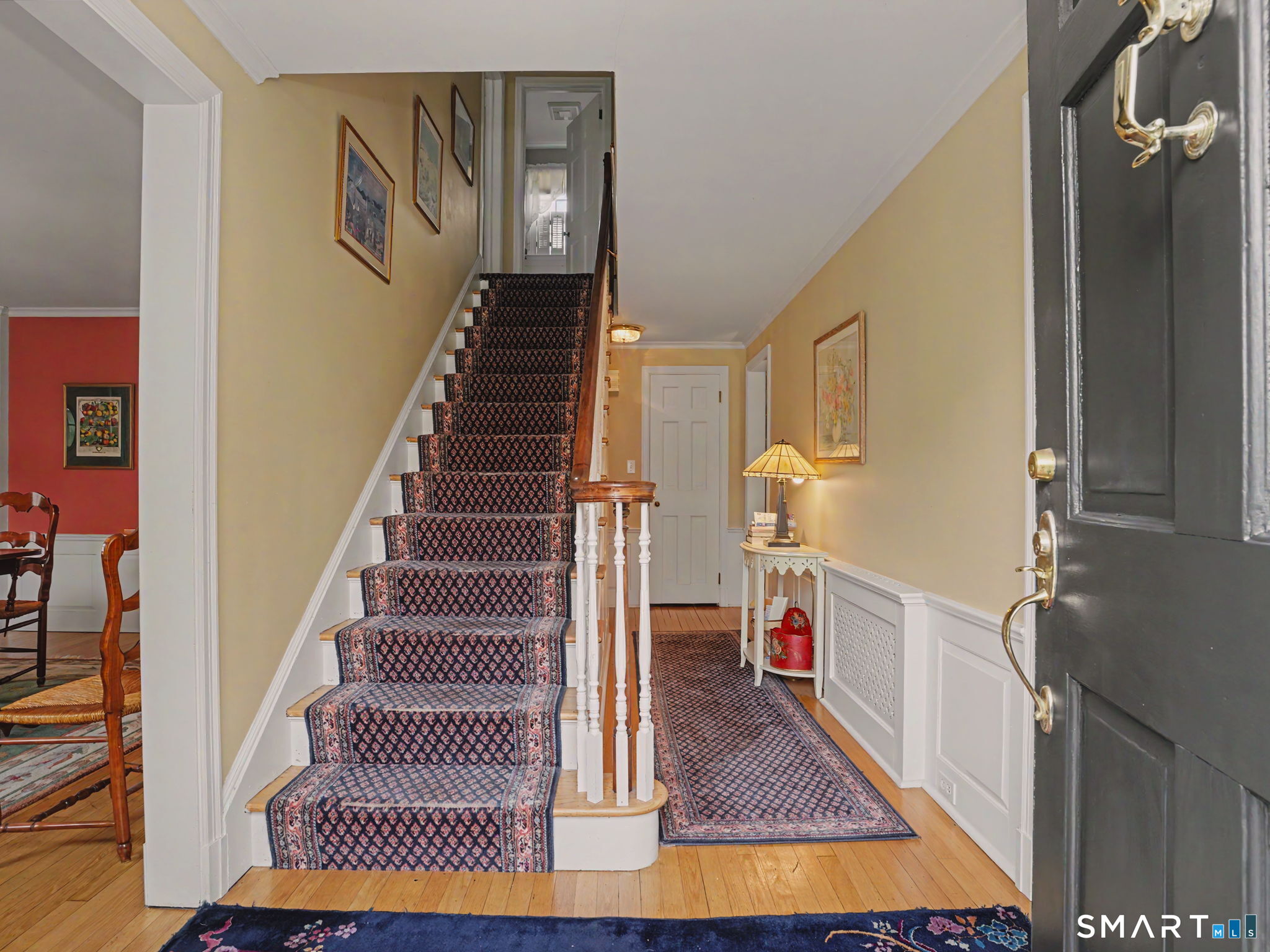 20 Chelsea Street Fairfield, CT 06824 - Photo 2 of 28 a view of entryway and hall with wooden floor