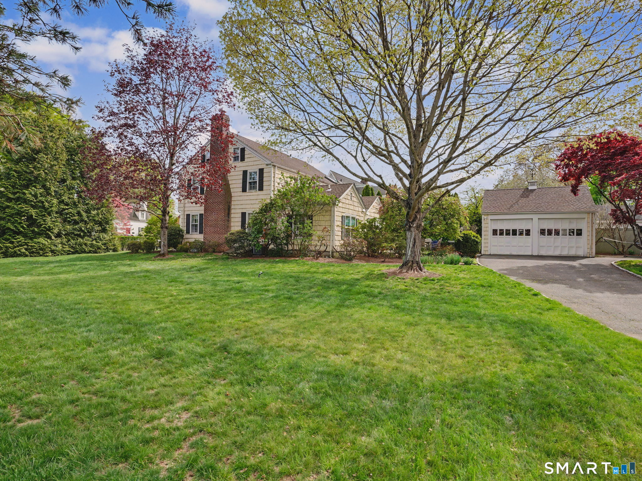 20 Chelsea Street Fairfield, CT 06824 - Photo 27 of 28 a view of a house with a yard