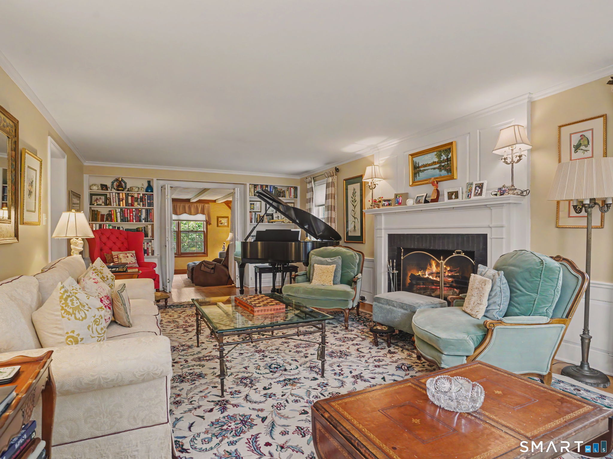 20 Chelsea Street Fairfield, CT 06824 - Photo 4 of 28 a living room with furniture and a fireplace