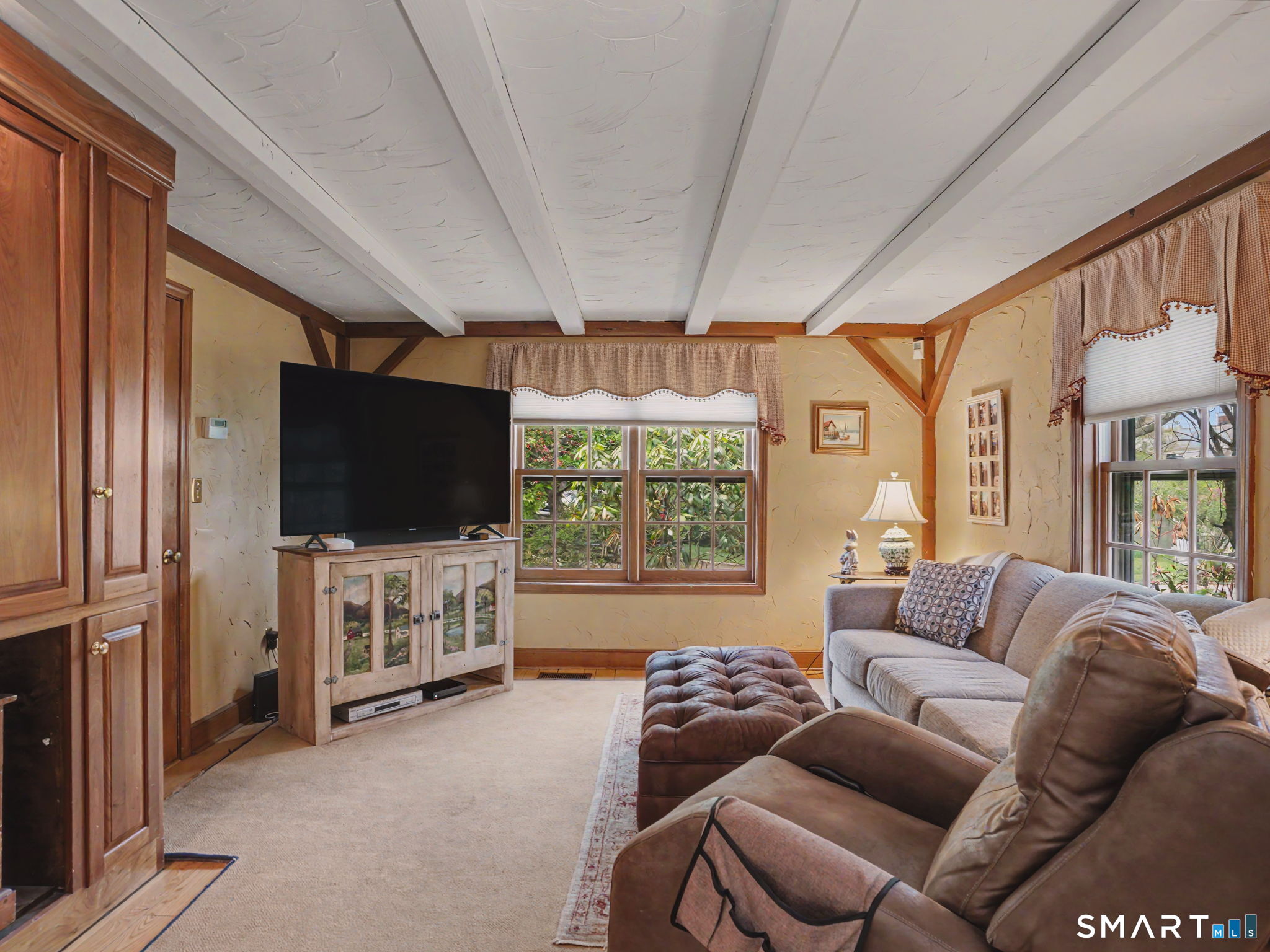 20 Chelsea Street Fairfield, CT 06824 - Photo 5 of 28 a living room with furniture and a flat screen tv
