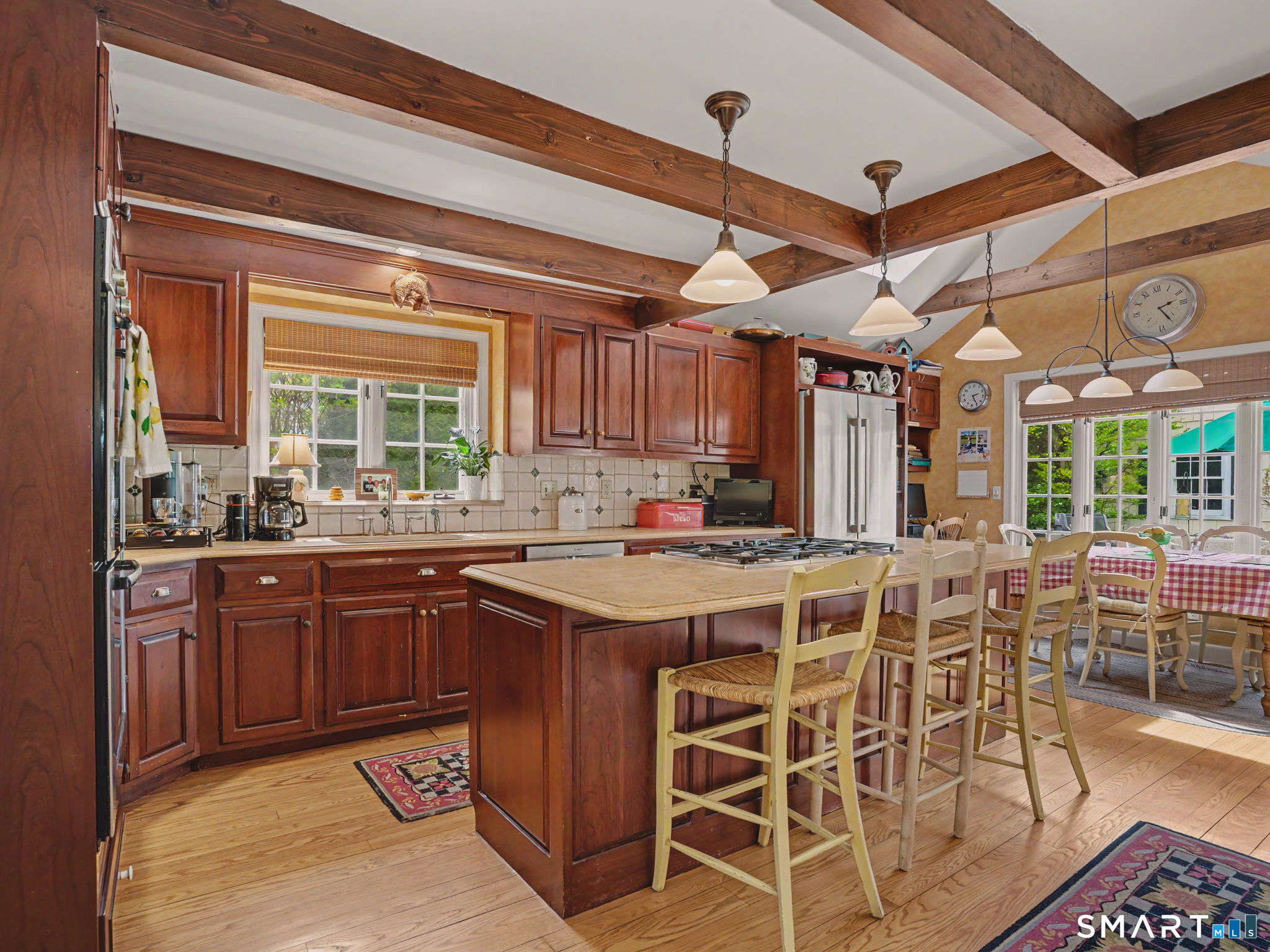 20 Chelsea Street Fairfield, CT 06824 - Photo 9 of 28 a kitchen with cabinets and chairs