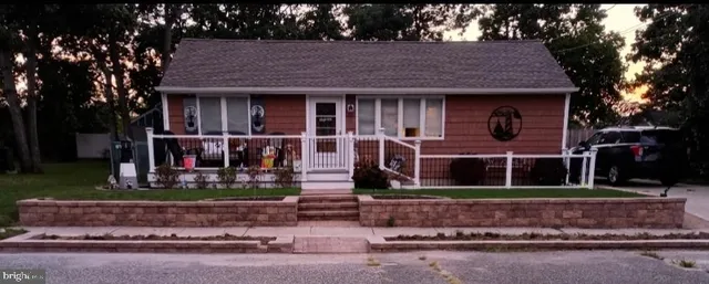 front view of a house with a small yard