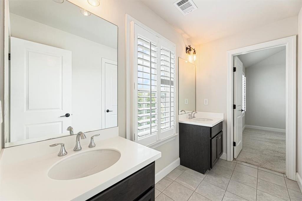 947 Hunter Way Milton, GA 30004 - Photo 64 of 78 a bathroom with a sink and a mirror