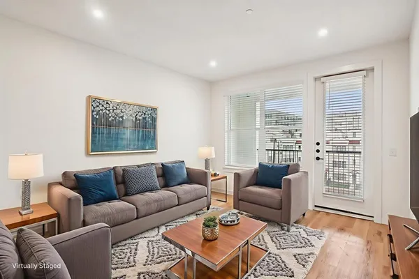 a living room with furniture and a window