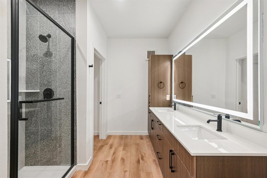 2016 South Ervay Street, Unit A2 Dallas, TX 75215 - Photo 17 of 35 a bathroom with a double vanity sink and mirror