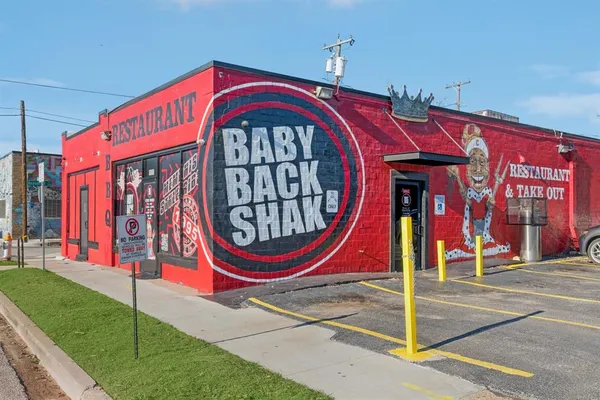 a front view of a house with entryway and a yard