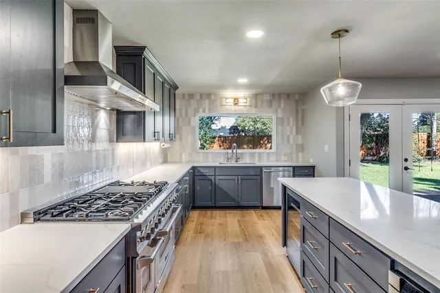 a kitchen with kitchen island granite countertop wooden cabinets and a refrigerator