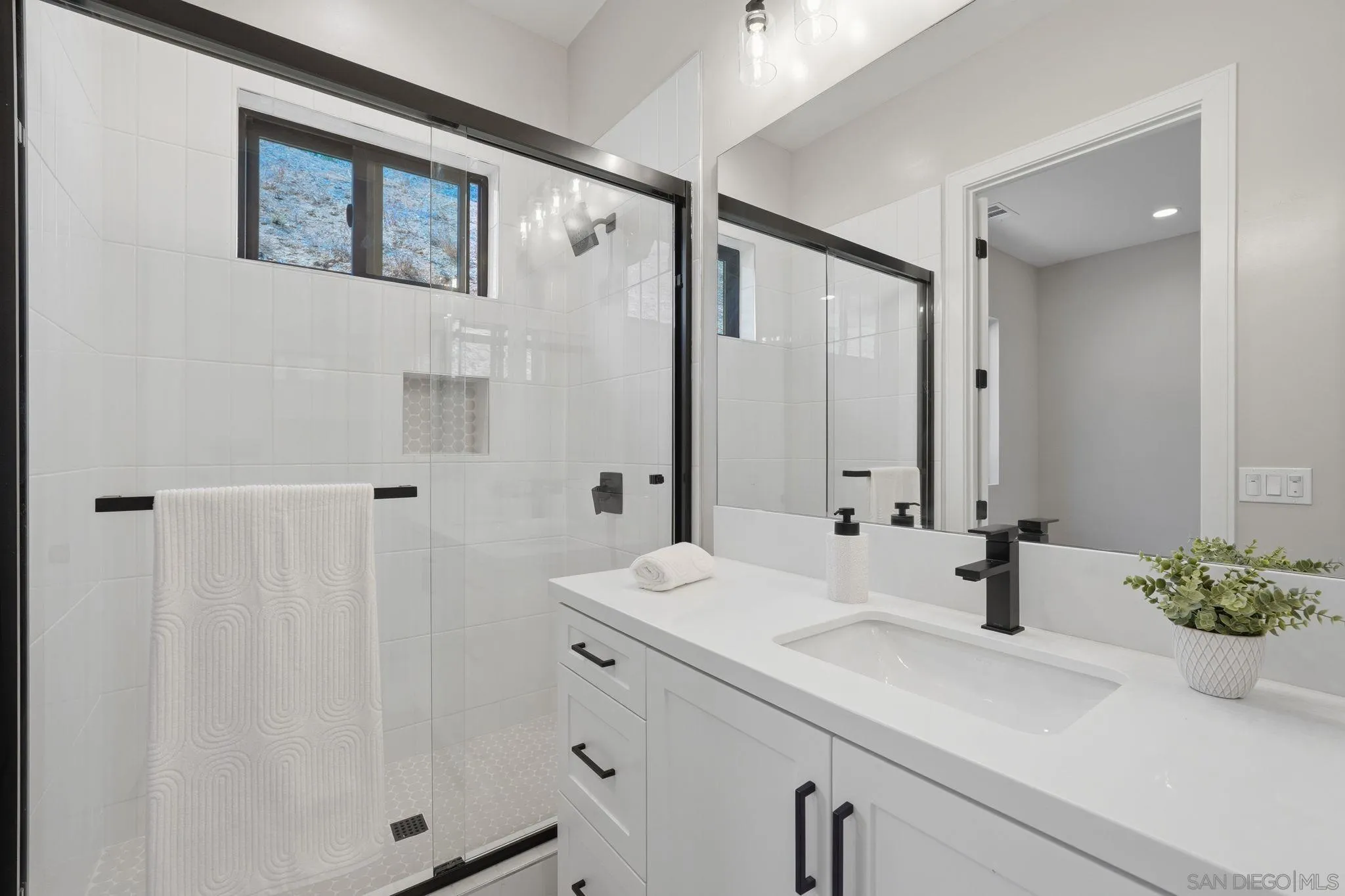 3916 Citrus Drive Fallbrook, CA 92028 - Photo 38 of 72 a bathroom with a sink and a mirror