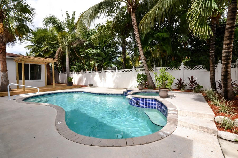117 Gregory Road West Palm Beach, FL 33405 - Photo 9 of 11 Pool & Deck with Arbor