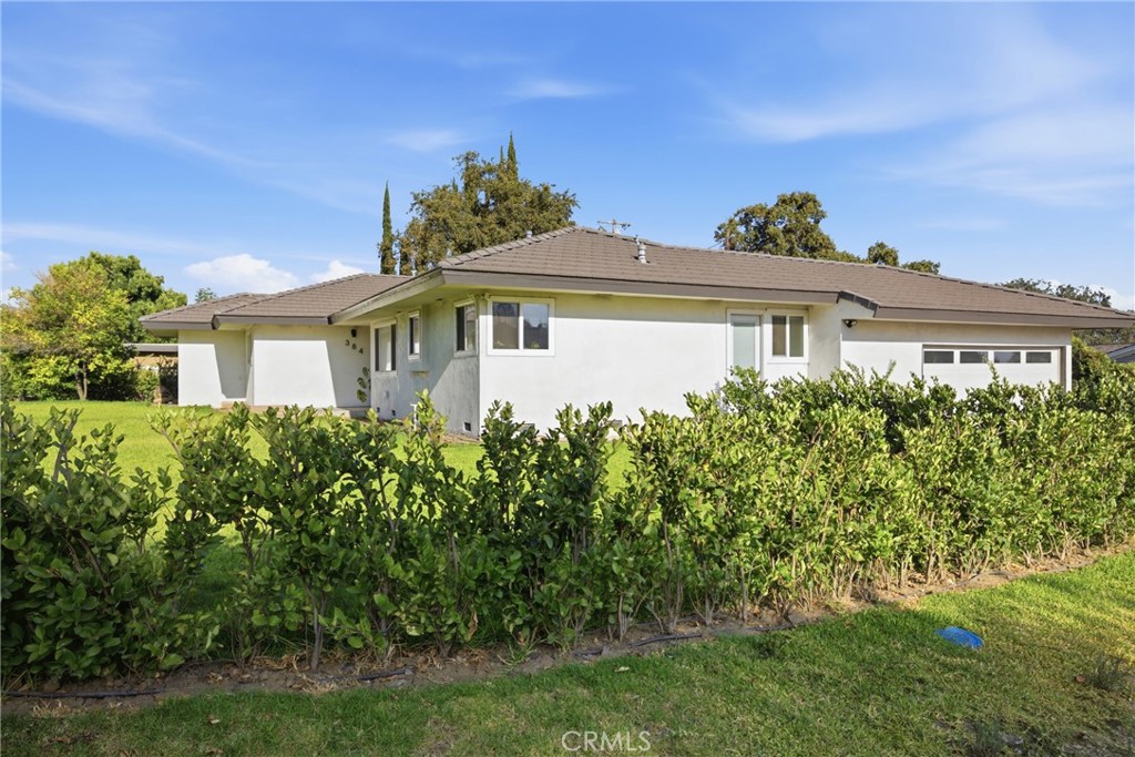 384 Colorado Street Arcadia, CA 91007 - Photo 12 of 51 a front view of a house with a yard