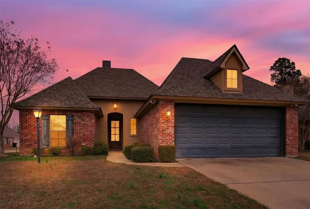 a front view of a house with yard