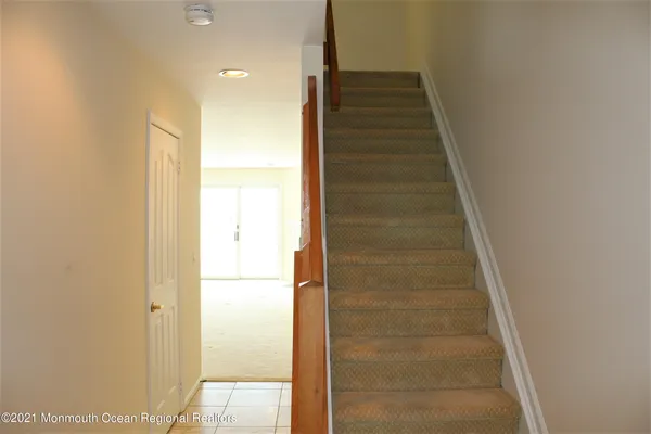 a kitchen with stainless steel appliances granite countertop a refrigerator and a stove